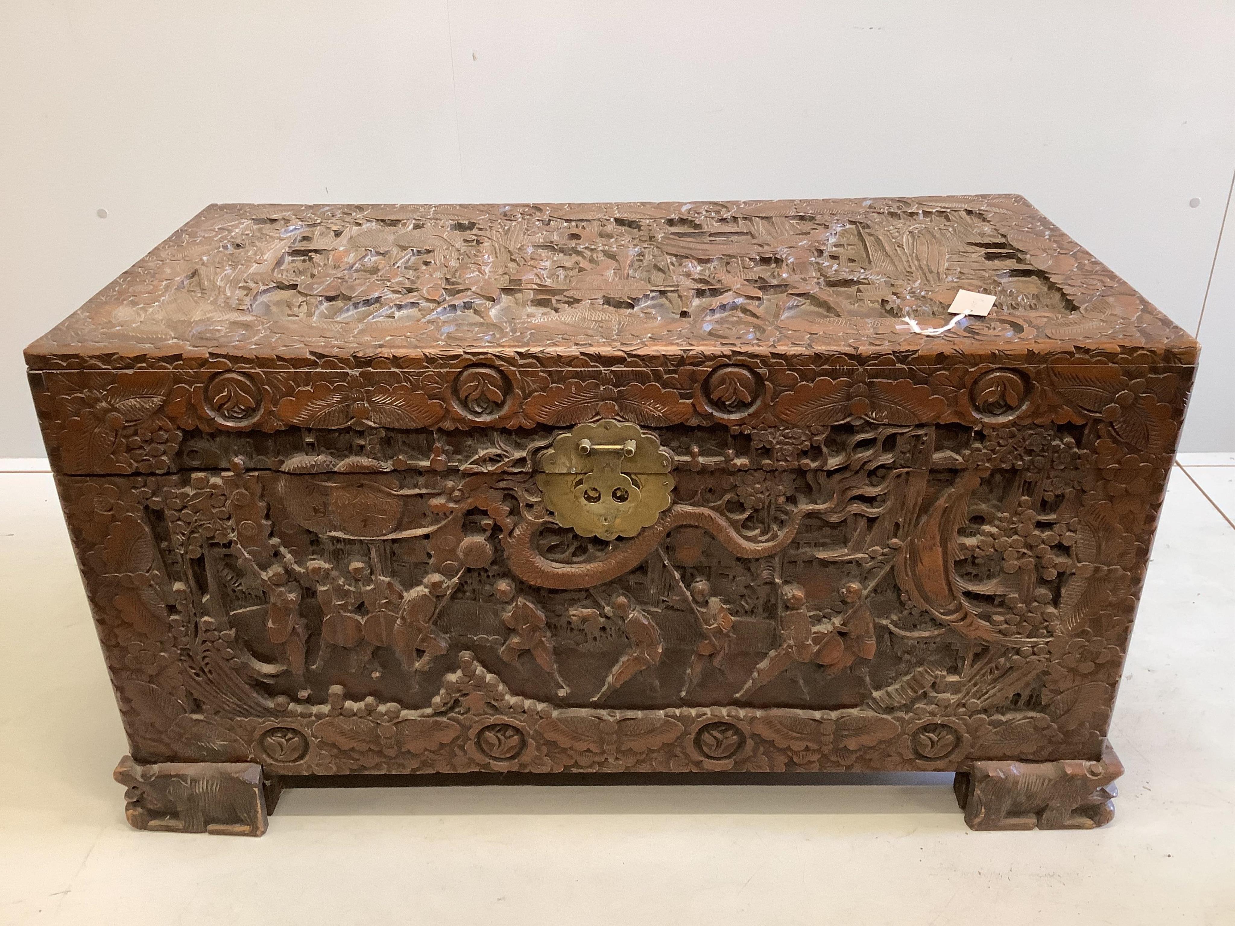 A Chinese carved camphor wood trunk, width 104cm, depth 51cm, height 57cm. Condition - fair